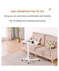Built Different Overbed Table With Adjustable Height For Bedside Care And Work From Home Vibes Smooth Locking Casters in a living room with a couch.