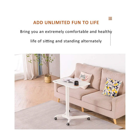 Slick Mobile Overbed Table With Smooth Rolling Wheels Adjustable Height Portable Sofa Desk For Bedside Dining Remote Work Hassle Free Setup Smart Design Dreamy Workspace White Silver Finish No Sweat Assembly next to a beige couch.