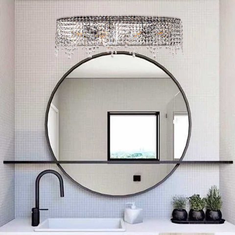 Modern luxury bathroom featuring Crystal Drape Vanity Light 24 Inch Chrome over mirror with sparkling crystals and ceramic fixtures.