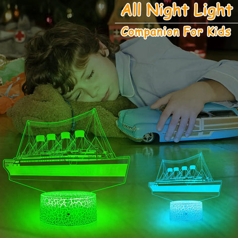Boy sleeping beside glowing green Titanic Night Light For Kids With Remote And Touch Control, 16 Color Changing LED Ship Night Light
