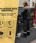 3 X 5 Foot Anti Fatigue Floor Mat Extra Thick Fifteen Sixteenths Inch Ergonomic Diamond Plate Heavy Duty Non Slip Industrial Grade Mat To Ease Leg And Back Pain Durable Gray used by worker in industrial setting.
