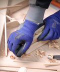 Level 5 Cut Resistant Work Gloves With Nitrile Palm Grip For Dry To Oily Surfaces being used in woodworking.