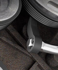 Close-up of Two Pack Pry Bar Wrench Adapter and Ratchet Pry Bar Attachment fitted in machinery with metal finish.