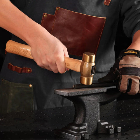 Craftsman using Drop Forged Solid Brass Non Sparking Hammer 20 Oz With Hickory Wood Handle And Laser Etched Texture for metalwork