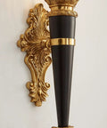 Solid Copper Wall Sconce Clear Textured Glass Shade Matte Black With Brushed Gold Trim Heavy Duty Indoor Lighting Fixture For Primary Bedroom Living Space Hallway Entryway Straight Fire Glow detailed view of gold-trimmed black wall sconce.