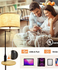 Couple on couch next to lamp with USB port and tech specs displayed, includes UL listing and charging compatibility