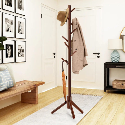 Freestanding Coat Rack With 8 Hooks And 3 Adjustable Tree Sections for bedroom with hats, coats, and umbrellas hanging on it.