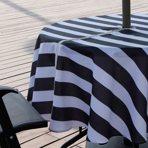Outdoor Round Tablecloth 60 Inch With Zipper Umbrella Hole Water Resistant Polyester Durable Patio Garden Table Cover For BBQs And Parties Easy To Clean Shrink Resistant Black on a patio table.