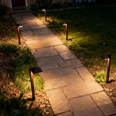 Low Voltage Outdoor Pathway Lighting Kit With 0.6W LED 3100K Warm White 12V Metal Path Lights In Charcoal Brown 8 Pack illuminating a walkway