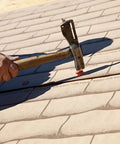 Bulletproof Plastic Cap Nails For Roofing Underlayment And Housewrap Fastening Electro Galvanized Steel Wide Round Cap Ringed Shank One Three Quarter Inch Two Thousand Count Smooth Sailing being installed on underlayment.