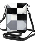 Slick Black And White Piano Plate Grid Print Crossbody Bag Crafted From Soft Water Repellent Synthetic Suede With Secure Strap, shown from the front with a long strap.