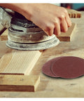 Top 100 Piece 3 Inch Sandpaper Discs With Super Grippy Backing Pads For Metal Wood And Plastic Polishing in use on wood surface.
