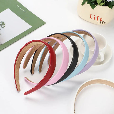 Wide 1 Inch Ultra Soft PU Leather Headband For Women Girls Comfortable Padded Faux Hair Band in various colors arranged together.