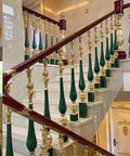 Top Shelf Aluminum Baluster Spindles With 270 Degree Tilt Bracket For Adjustable Stair Railing Decks And Patios Heavy Duty Guard Posts Quick Floor Mount 15 Pack 37 Inch Tall stair railing with ornate green and gold baluster spindles.