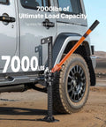VEVOR 42 Inch Farm Jack 7000 Lbs High Lift Utility Ratchet Off Road Heavy Duty Truck Tractor SUV Jeep Recovery Winch Clamp Pull Tool 5-36 In Range next to a truck tire.