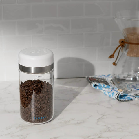 Keep Your Beans Fresh As A Daisy With This Smart Electric Vacuum Seal Coffee Canister And Airtight Storage Jar For Whole Ground Roasts Real Deal Smooth Push Button Operation Durable Borosilicate Glass with coffee beans.