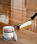 Clear Two Part Polyurethane Sealer Slaps On Smooth For Raw Wood And Brick Slick High Gloss UV Resistant Topcoat Nails The Deep Color Lock Covers Two Hundred Fifty Square Feet One Gallon Ready Mix applied with roller on wood floor.