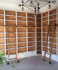 Killer Quality Black Steel Sliding Barn Door Hardware Kit With Adjustable Rustproof Rolling Library Ladder Track setup in modern shelving.