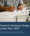 Designer reviewing cabinet hinge designs, emphasizing America's hardware leadership since 1893, for kitchen remodel ideas.