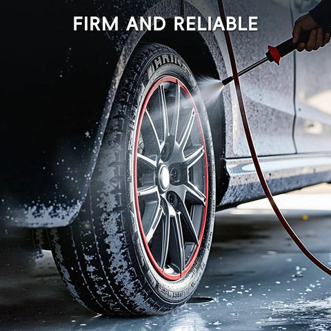 Pro Grade Black Wheel Rim Protectors Four Pack Universal Tire Edge Guards on alloy rim during washing with water spray.