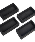 Four black graphite ingot molds for metal casting, each 4.01 x 2.01 x 1.01 inches