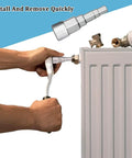 Hand using Heavy Duty Steel Radiator Wrench Socket With Stepped Multi Fitting Shape For Thermostatic Valves And Drain Pipes.