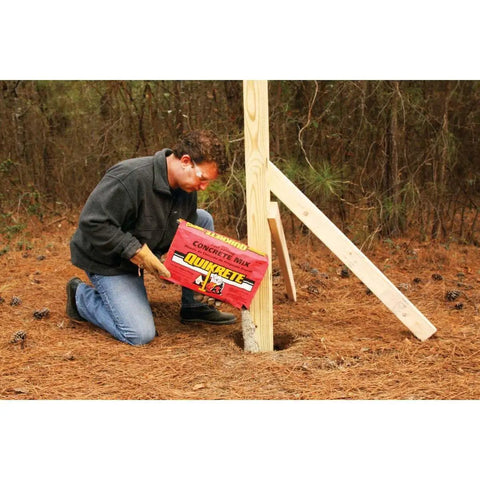 Man using Fast Setting Concrete Mix 50 Lbs Bag for quick set concrete projects, DIY friendly with easy installation, brown gray blend outdoors.