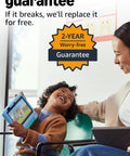 A happy child holding a blue 7-inch tablet, smiling with an adult, emphasizing the 2-year guarantee for heavy-duty tablets for kids.