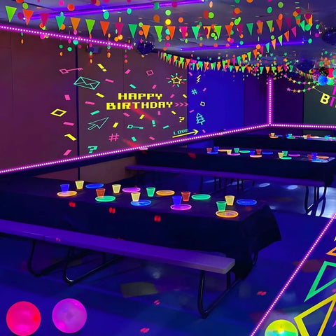 80Ft Black Light Strip With Remote, 1440 LEDs, Flexible 12V Glow Party Blacklights illuminating a decorated party room