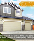 Powerful Solar Outdoor Lights With Motion Sensor And 240 Bright COB LEDs on garage, showing automatic on/off feature