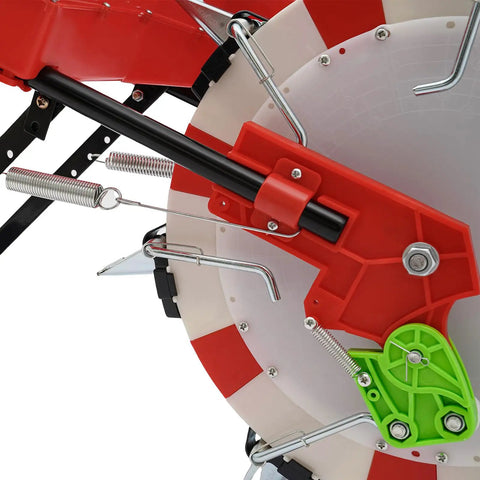 Close-up of red and green mechanism of Push Seeder Planter With 7 Seed Plates For Precise Row Spacing And Even Coverage.