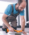 Man using Tile Vibration Leveling Tool With Suction Cup Handheld Vibrator For Plug And Play No Fuss Install on floor tiles