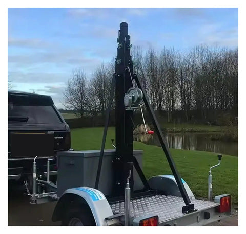 Heavy Duty 8M Telescopic Hand Winch Mast With Rock Solid Double Locking Rig For Led Lighting And Camera Poles mounted on trailer.