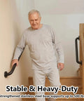 Hella Secure 12 Inch Stair Handrail And Wall Mounted Safety Grab Bar For Indoor Outdoor Steps providing a tight non slip matte black grip while heavy duty stainless steel frame handles 500 pounds with no sweat, installed near staircase.