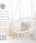 Bohemian Macrame Hammock Chair Swing With Hardware Kits For Indoor And Outdoor Use Ideal For Balcony Porch Yard Or Bedroom Cozy Supportive Knitted Seat With 265 Pound Capacity And Easy Hanging image showing chair with hardware kit and tassels.