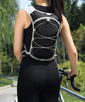 Back view of woman wearing Women Running Vest With Hydration Bladder Pack For Hiking Cycling And Climbing Trail Ready Ultralight Water Backpack