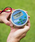 Node 200 Battery Operated Sprinkler Timer For 2 Zone Waterproof Irrigation Controller shown held in hand on grass background.