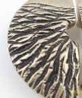 Close-up of Solid Brass Circle Cabinet Pulls With Textured Dune Design And Dope Antique Gold Finish, Hand Cast Hardware