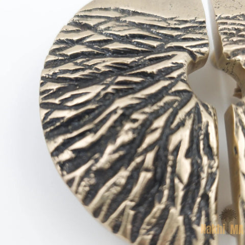 Close-up of Solid Brass Circle Cabinet Pulls With Textured Dune Design And Dope Antique Gold Finish, Hand Cast Hardware