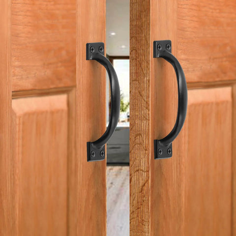 Vintage Inspired 5.5 Inch Black Curved Cabinet Door Handles Made From Solid Iron installed on wooden cabinet doors.