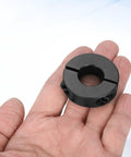 Hand holding Two Pack Double Split Shaft Collars 18mm Bore 40mm Outer Diameter 12mm Thick Clamping Collar With Set Screws Carbon Steel