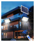 Rock Solid Dual Led Solar Flood Lights With Remote And Dusk To Dawn Switch illuminating a modern home exterior with solar panel.