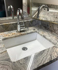 Compact White Ceramic Undermount Bathroom Sink 16.54 By 12.87 Inches With Overflow Rectangular Vanity Lavatory Basin installed in countertop