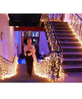 Warm White LED Icicle String Lights For Windows And Outdoor Spaces 16.4Ft 216 LEDs illuminating a staircase in 8 modes