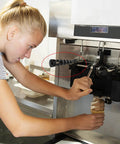 Person using ergonomic ice cream maker replacement handle grip lever fits most machines durable high temp part.