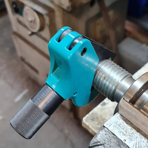 Universal Thread Repair Tool And Restorer For All Threads In Range Five Eighths Inch To One And A Half Inches External Or Internal Threads Metric And SAE One Hand Tool Quick Sizing Chases And Repairs Threads installed on a metal thread