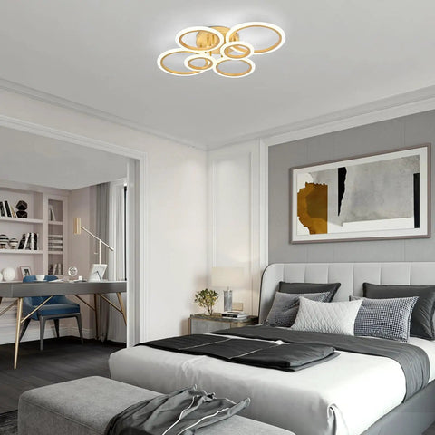 Modern LED Ceiling Light With Six Ring Gold Finish Flush Mount Fixture 4000K Neutral White Lighting in a bedroom setting
