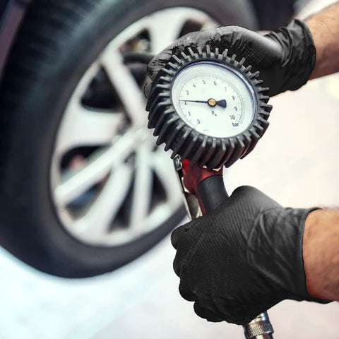 Heavy Duty Black Nitrile Disposable Gloves Medium 8 Mil Thick 100 Pack Latex And Powder Free Industrial Safety Gear used for checking tire pressure.