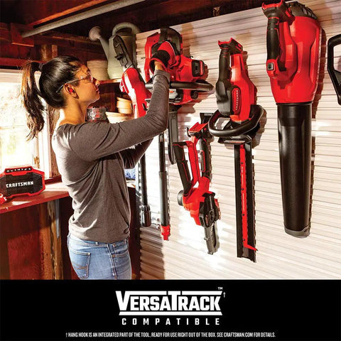 Person hanging powerful corded leaf blower with 9 Amp motor, lightweight handheld axial electric blower on VersaTrack system.