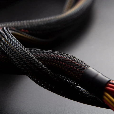 Close-up of 96ft Braided Cable Sleeve Kit With 6 Expandable Sleeves And 127 Heat Shrink Tubes For Audio Video Cables in black and red.
